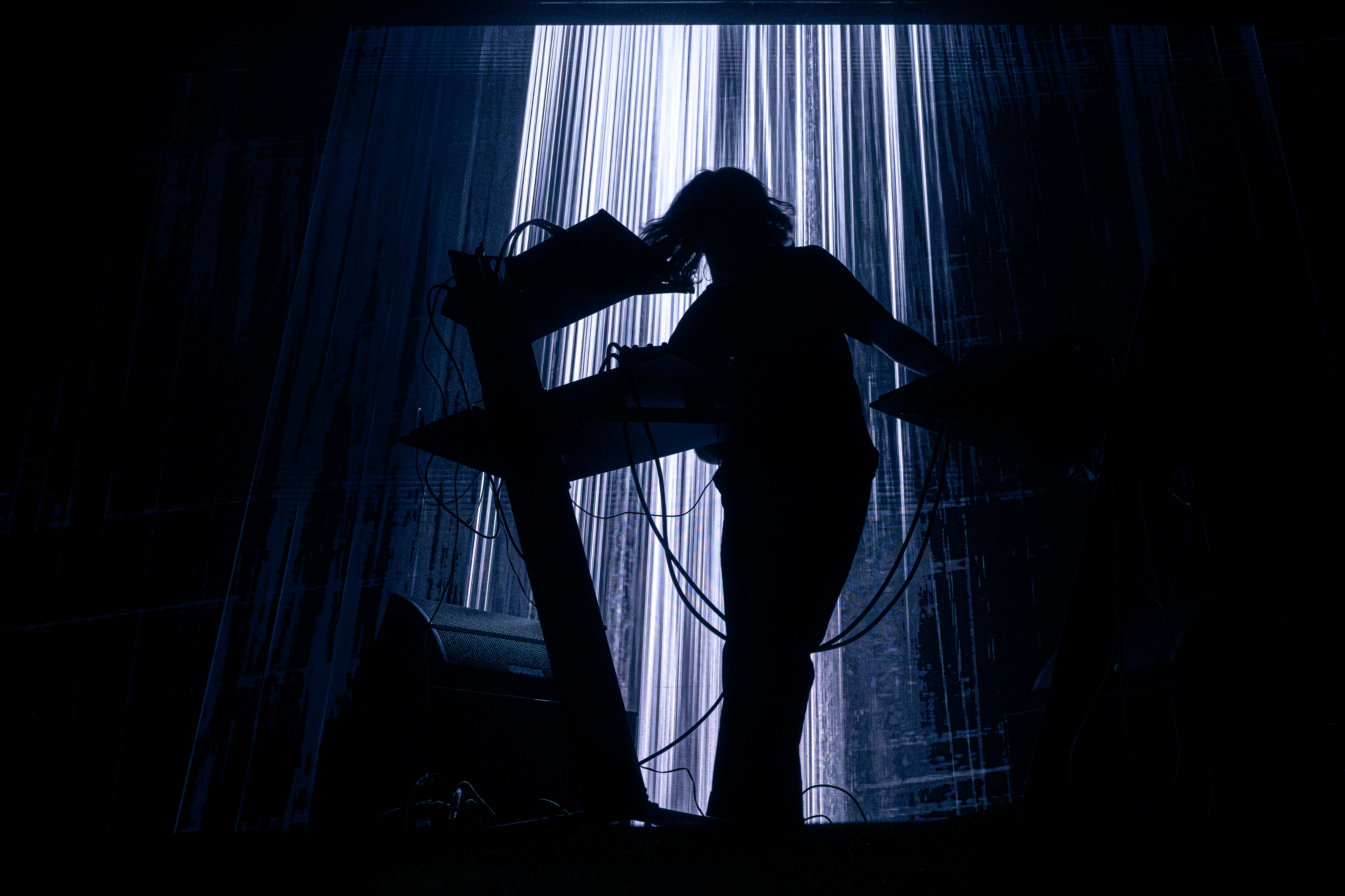 Musicians playing live at a concert, engaging with the audience and delivering an electrifying performance